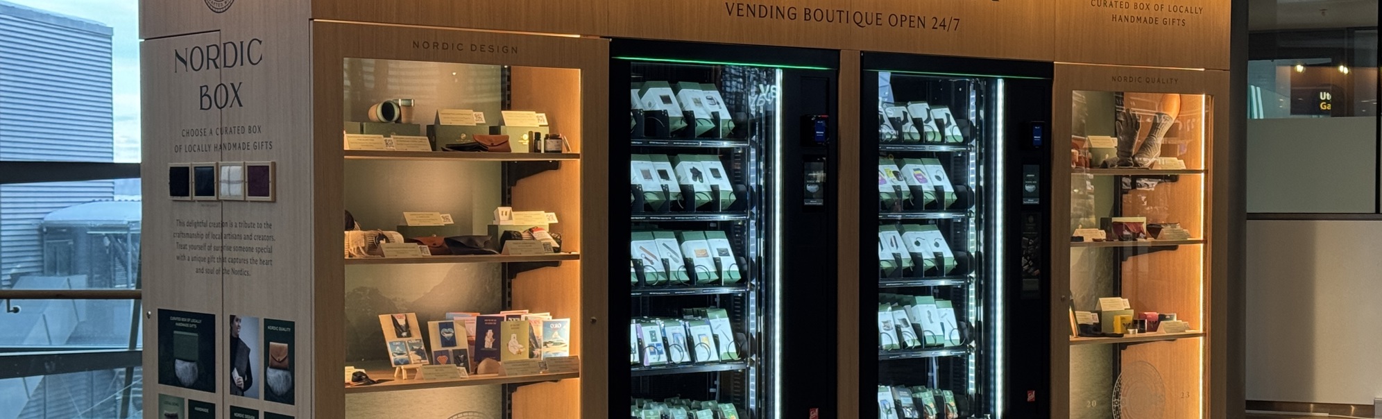 Nordic Box vending boutique with illuminated shelves and vending machines showcasing locally handmade gifts, located in a modern indoor setting