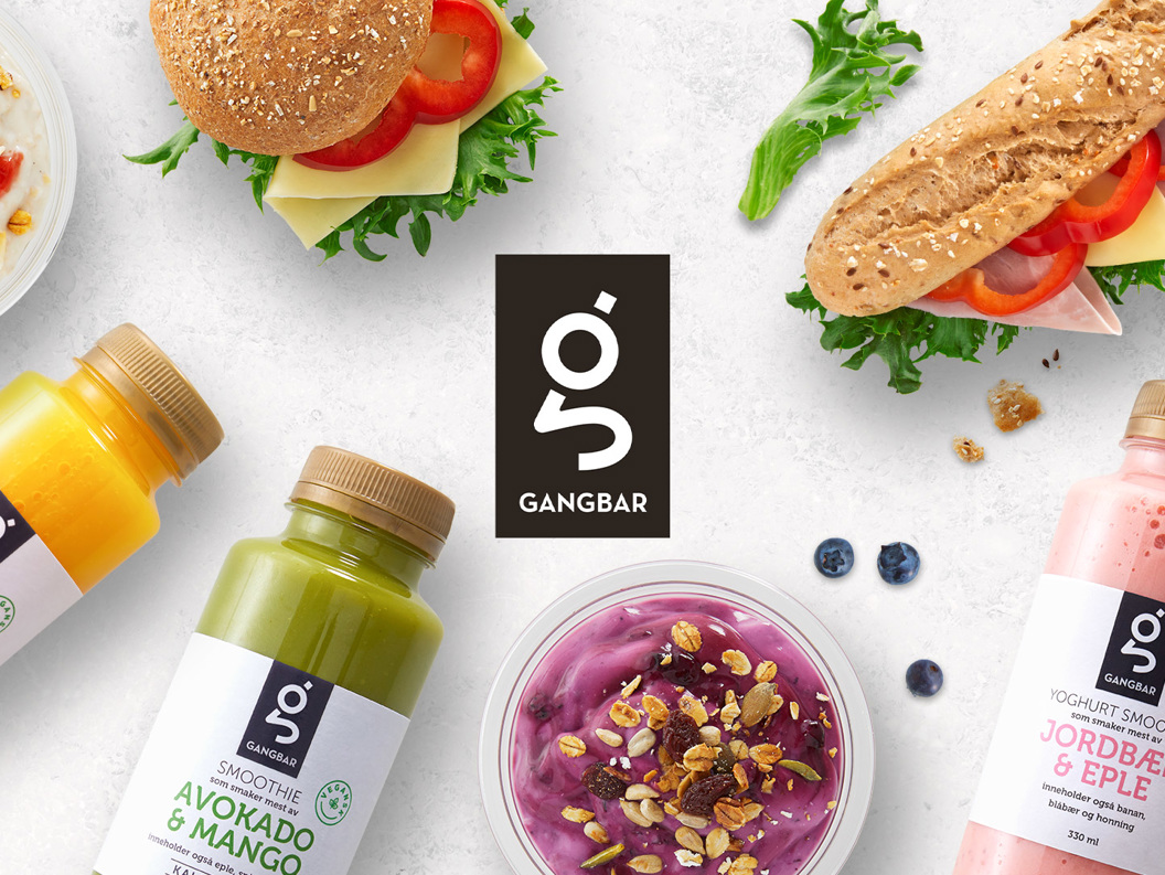 Gangbar food and drink assortment featuring smoothies, juices, yogurt cups, sandwiches, and burgers with fresh ingredients displayed on a white background