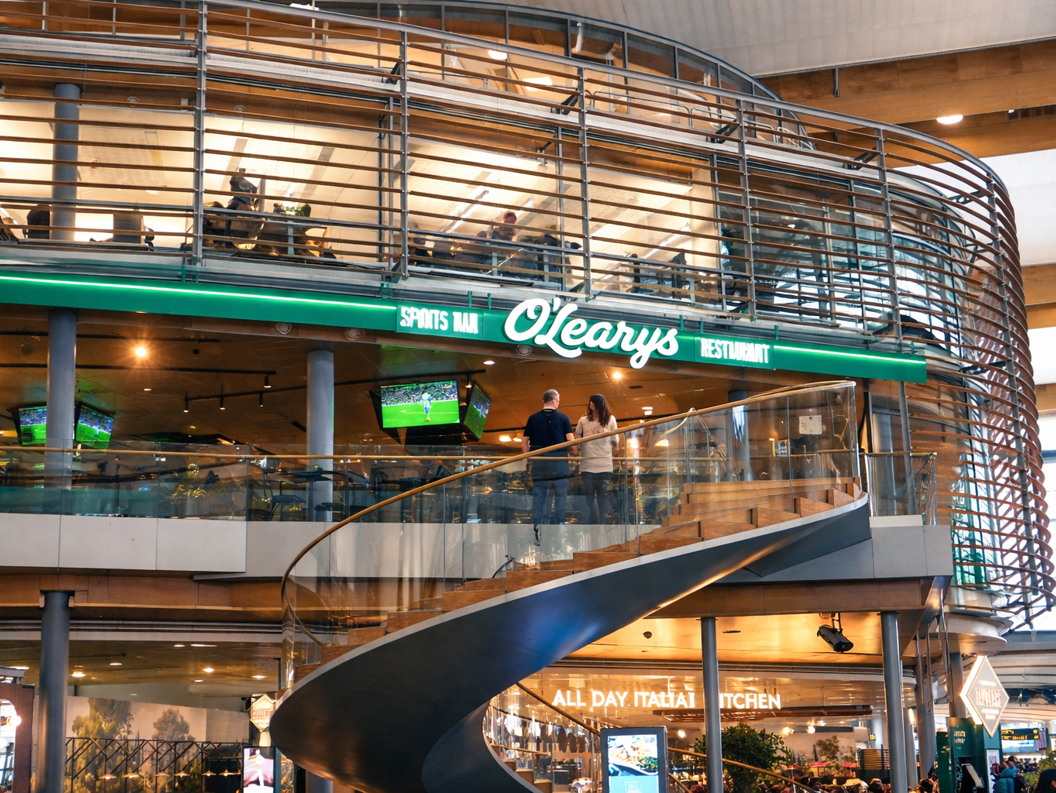 Three gourmet burgers with diverse toppings, served on a rustic black table, highlighting juicy beef patties, fresh lettuce, and melted cheese