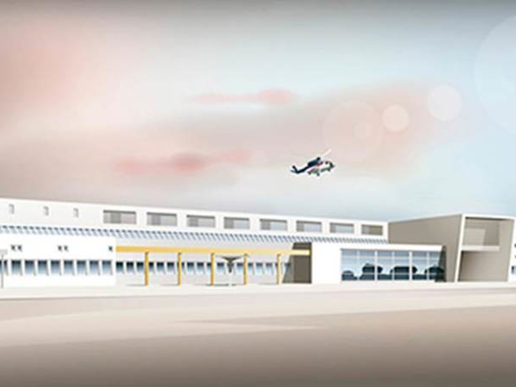 Airport building with modern design, seen in daylight with a helicopter hovering in the background.